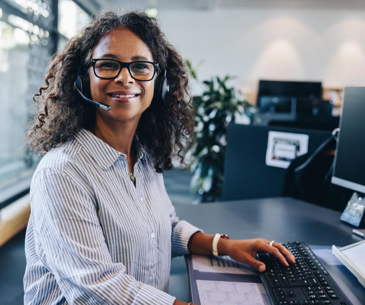 Customer service representative enjoying the benefits of a professional phone system installation