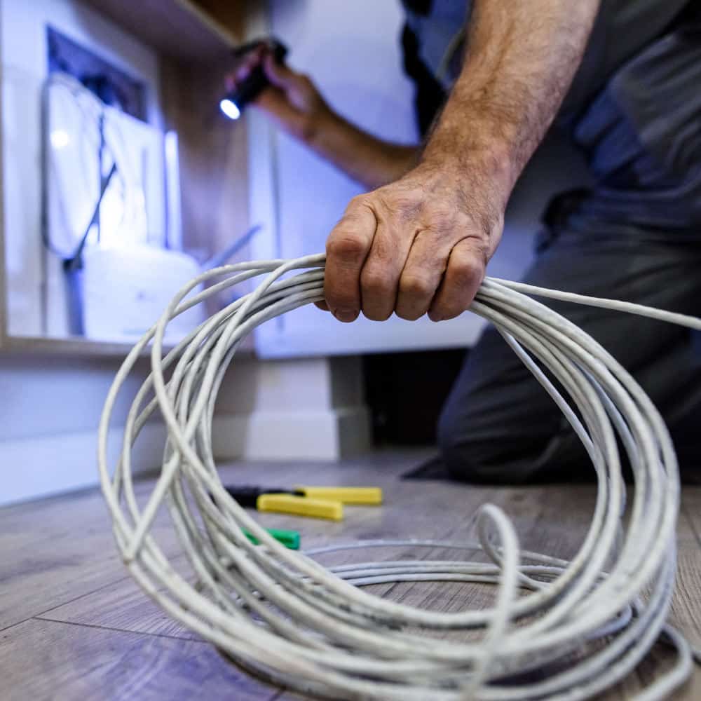 Network technician removing network cables